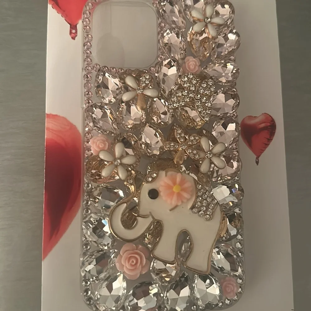 I phone 12 Pro protective cover.pink stones, white enamel flowers & elephant NWT